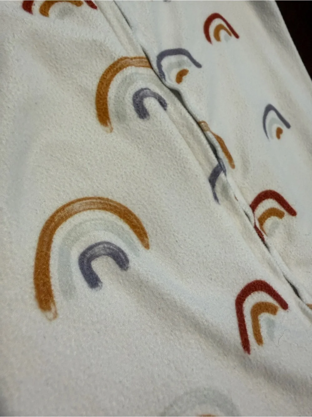 Caden Lane Cream Footed One-Piece with Rainbow Print
